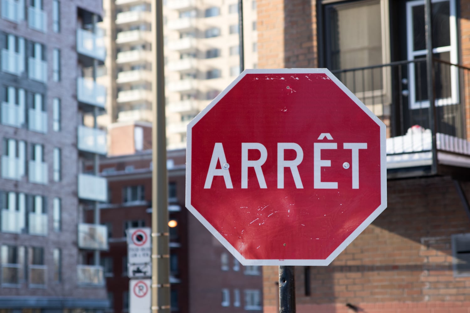 French stop sign. Interesting fact is Quebec is one of the only places where the term Arret is used on these signs. Even in France the signs say stop. 