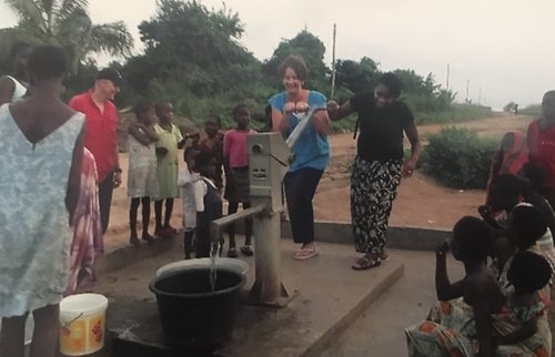 Trying out one of the new water pumps! One of many freshwater projects made possible through partnerships with Theovision International. This pump is shared by several neighboring villages