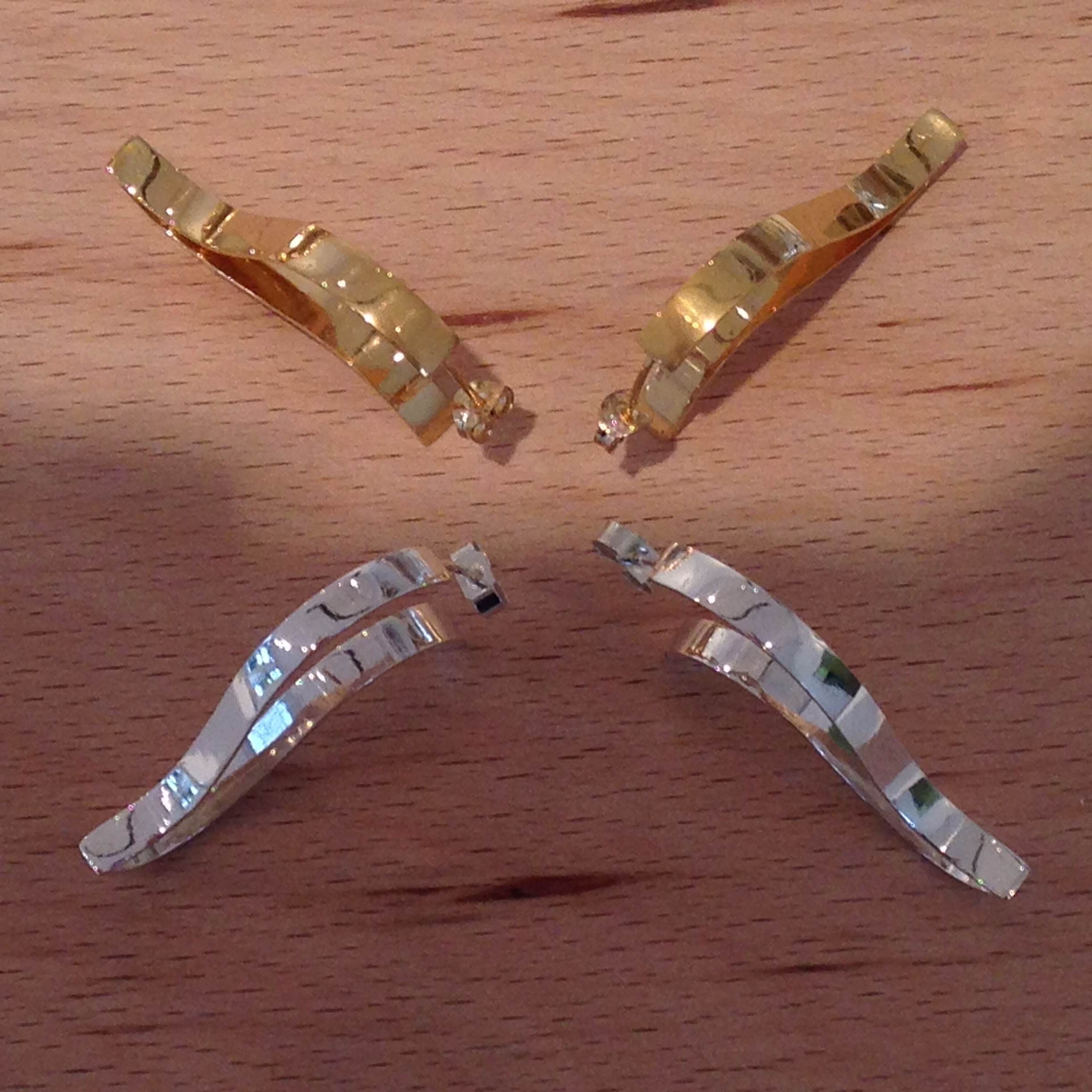 Silver and gold wave-shaped earrings