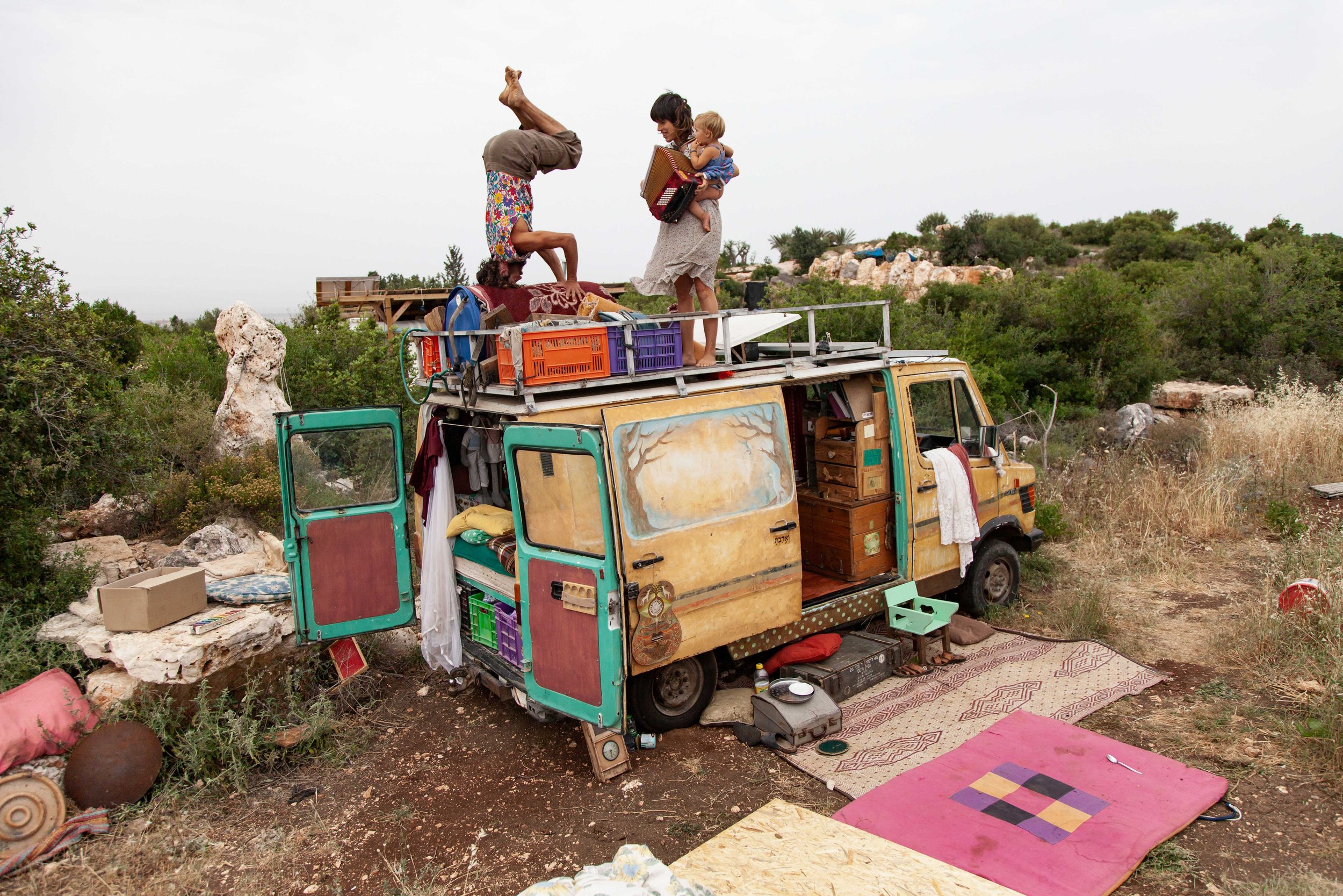 After spending several months travelling the country, the family arrives at Adama – a village in the Galilee that is home to a handful of families. They decide to park their caravan there.Amnon, Tamar, and Malmalu Barri messing about on the rooftop