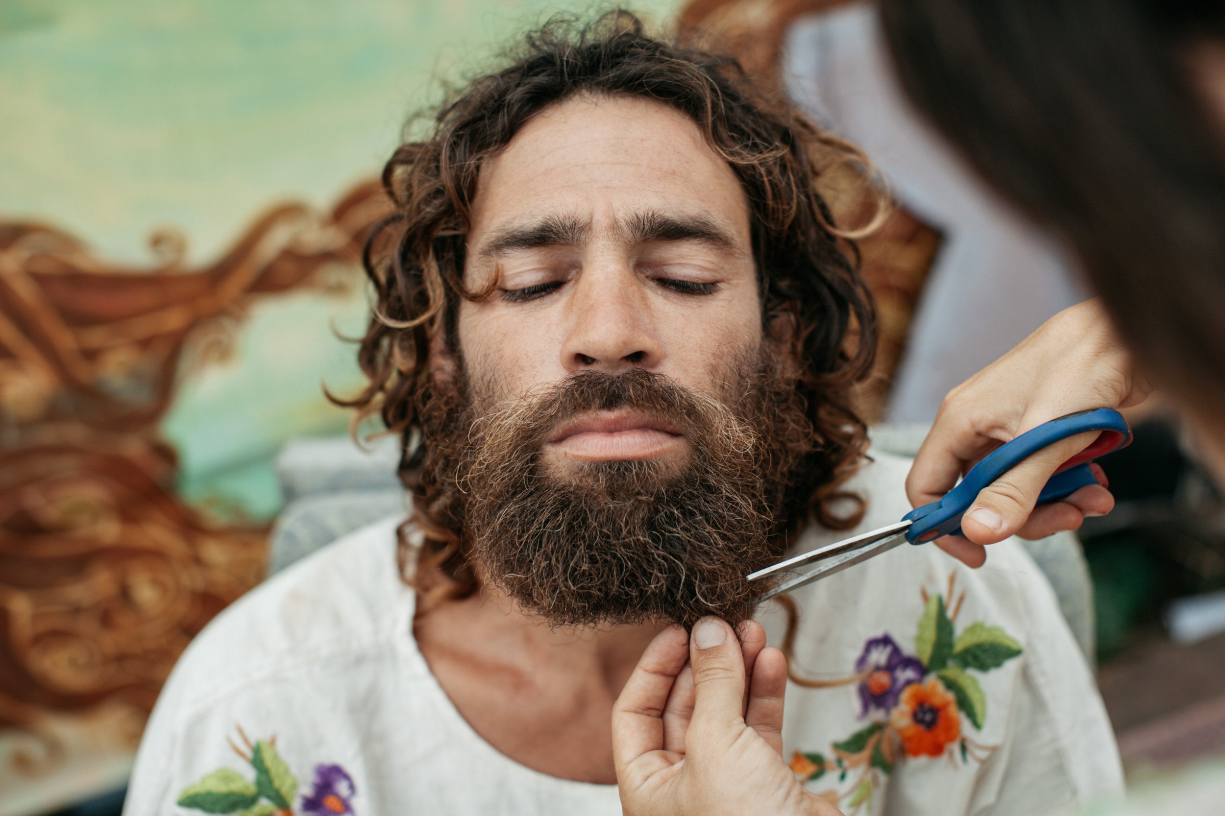 Tamar trimming and grooming Amon’s beard.Galille, Israel