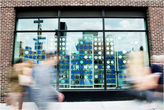 Temporary installation for window display of award-winning Story retail space in Chelsea, Manhattan. "Making Things" competition was sponsored by GE Garages. Installation was an interactive, with motorized discs that responded to body shapes and movements of passersby. As discs, activated by web cams and custom coding, turned in correspondence to bodies, they offered passersby a glimpse into the store inside. More at Architizer .