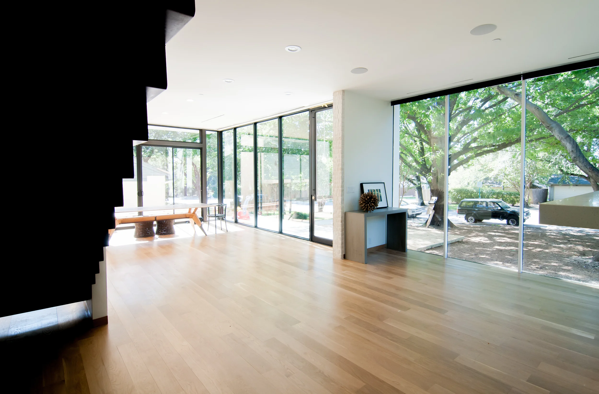Custom new-build home in University Park / Dallas. "See-through" house features glass expanses contrasting with textured brick, achieving contemporary design within strict city guidelines and code. Close collabortation with clients on design, materials, art, and furnishings. 4 bedroom, 5.5 bath, plus study and multiple living spaces. Completion: 2015 pictures by Jessica Garmon