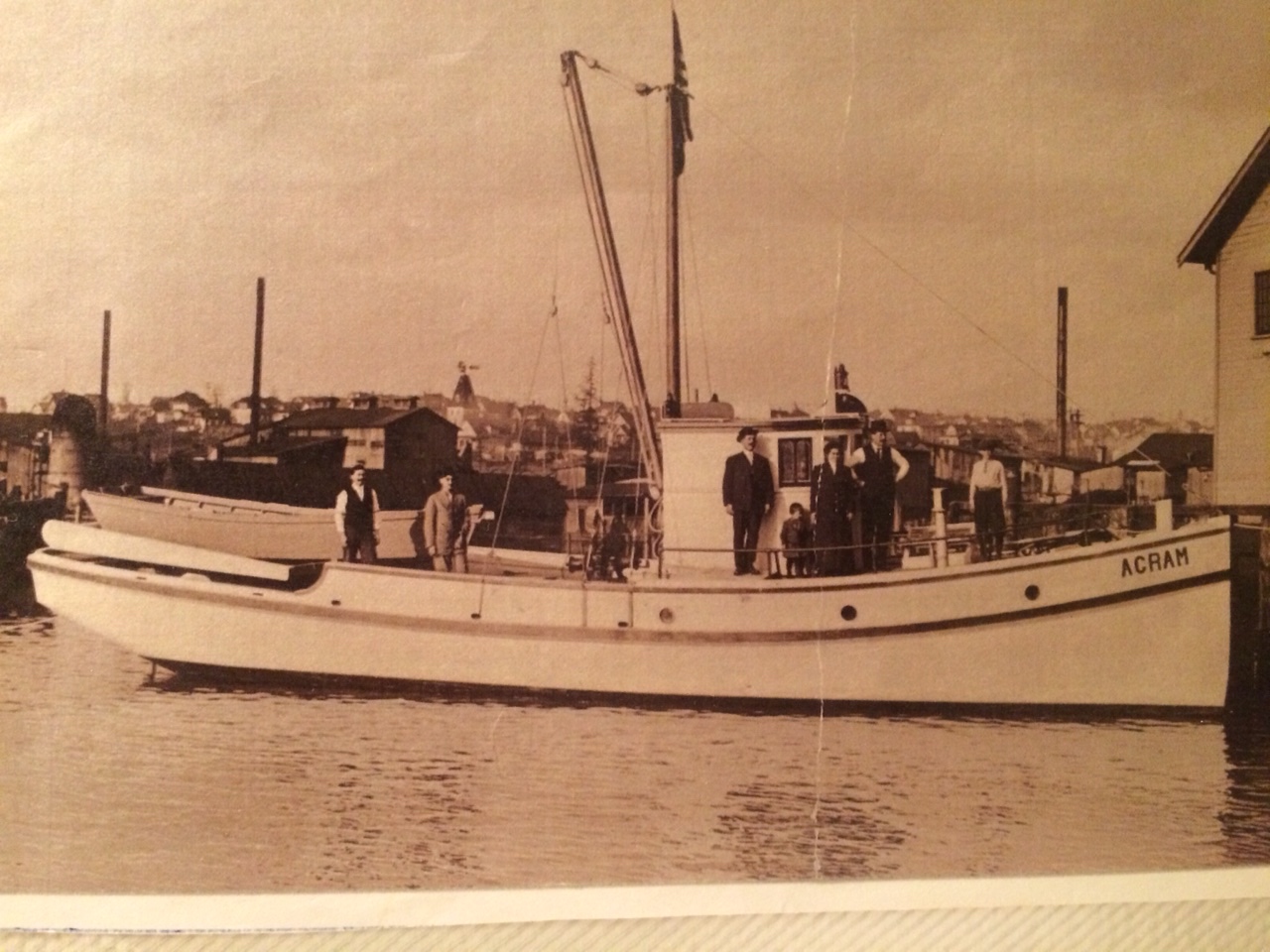My great-grandfather's boat. My grandpa is the little one standing in front of the wheel house. My great-grandparents are standing on either side of him. This is still in Ballard. Agram is a town in Croatia; the boat was originally called Crikvenica, but everyone mispronounced the name, so he changed it.
