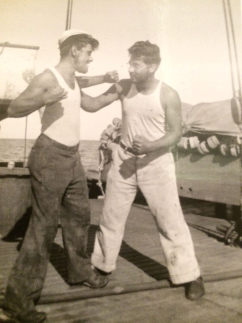 My grandfather on the right, on a fishing boat with a cousin. Possibly taking revenge for the eye?