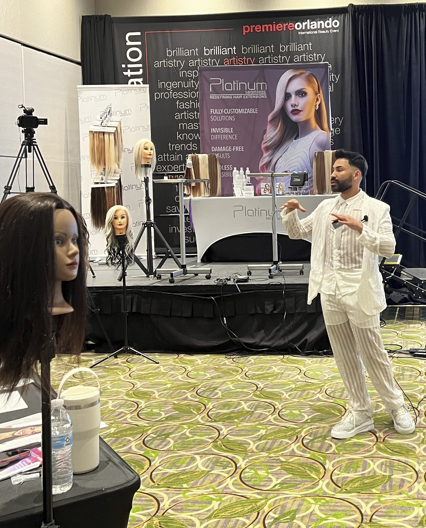 Instructor teaching hair extension theory and best practices during a Platinum Seamless® Academy class.