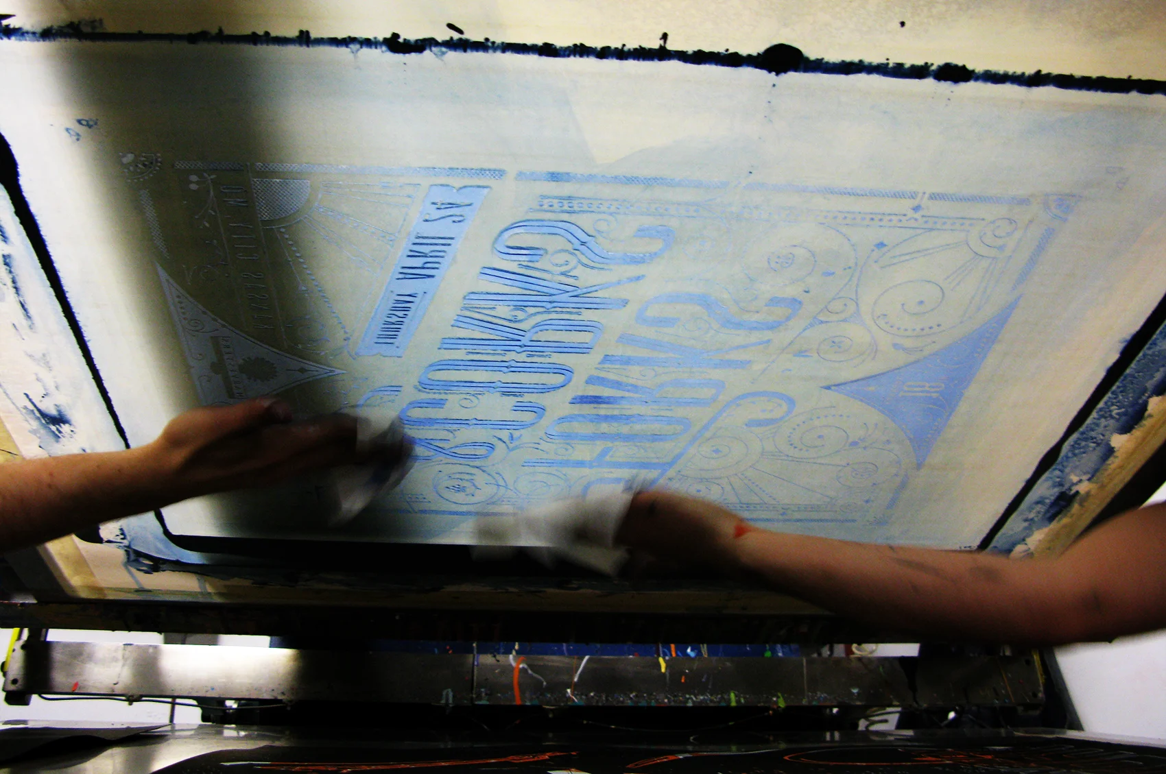 Wiping down the screen between test runs.