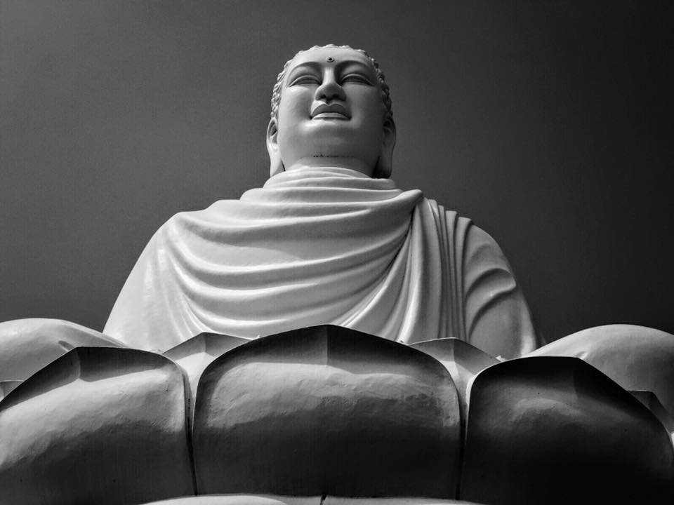 The giant white Buddha of Long Sơn Pagoda sits 24-meters tall in a lotus flower & looks over the city of Nha Trang, Vietnam. The Buddha is dedicated to seven monks who burned themselves alive in protest of the Vietnam War. 