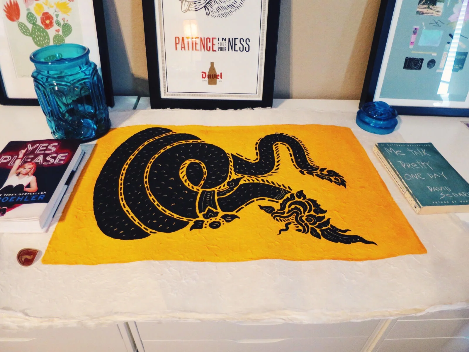 Dragon Screenprint purchased from a street vendor in Chiang Mai, Thailand. Duvel / Boulevard poster designed by Hammerpress purchased here.