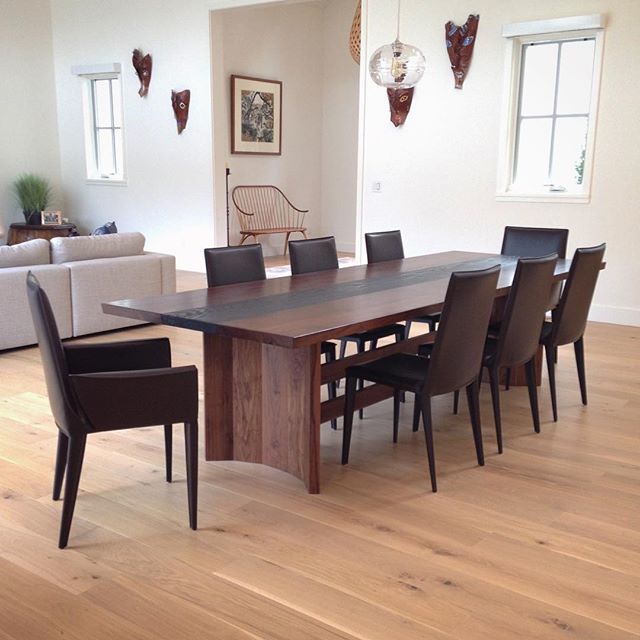 The Fireside Dining Table paired with Bottega chairs from @designwithinreach. This ten-foot long custom table is made of California claro walnut and scorched white oak. Lookin' pretty swag in its new abode! 😎 #jawwoodshop #firesidecollection #custom