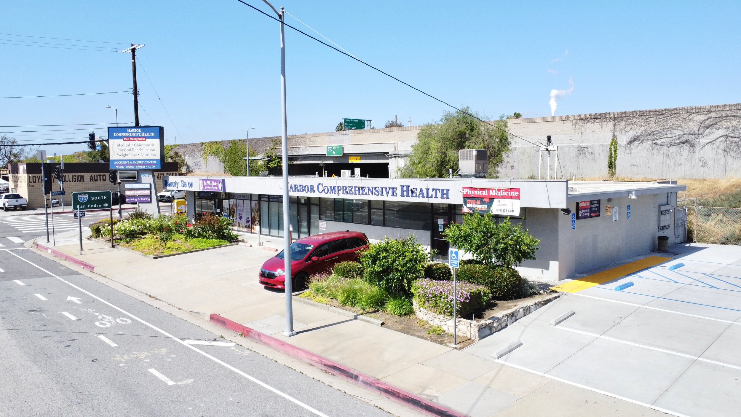 Street view of stripmall with Harbor Comprehensive Health. 