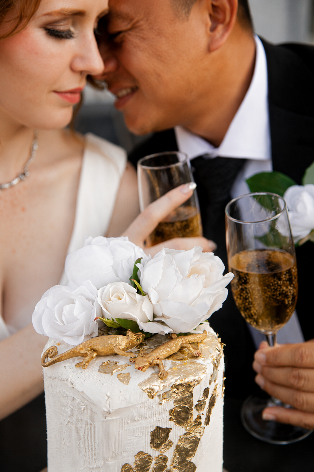 Rana and Nick during their intimate elopement in Mesa, Arizona, photographed by TallulahMade Photography. This romantic wedding portrait captures the couple celebrating their marriage against the warm desert architecture of Mesa, blending candid conn
