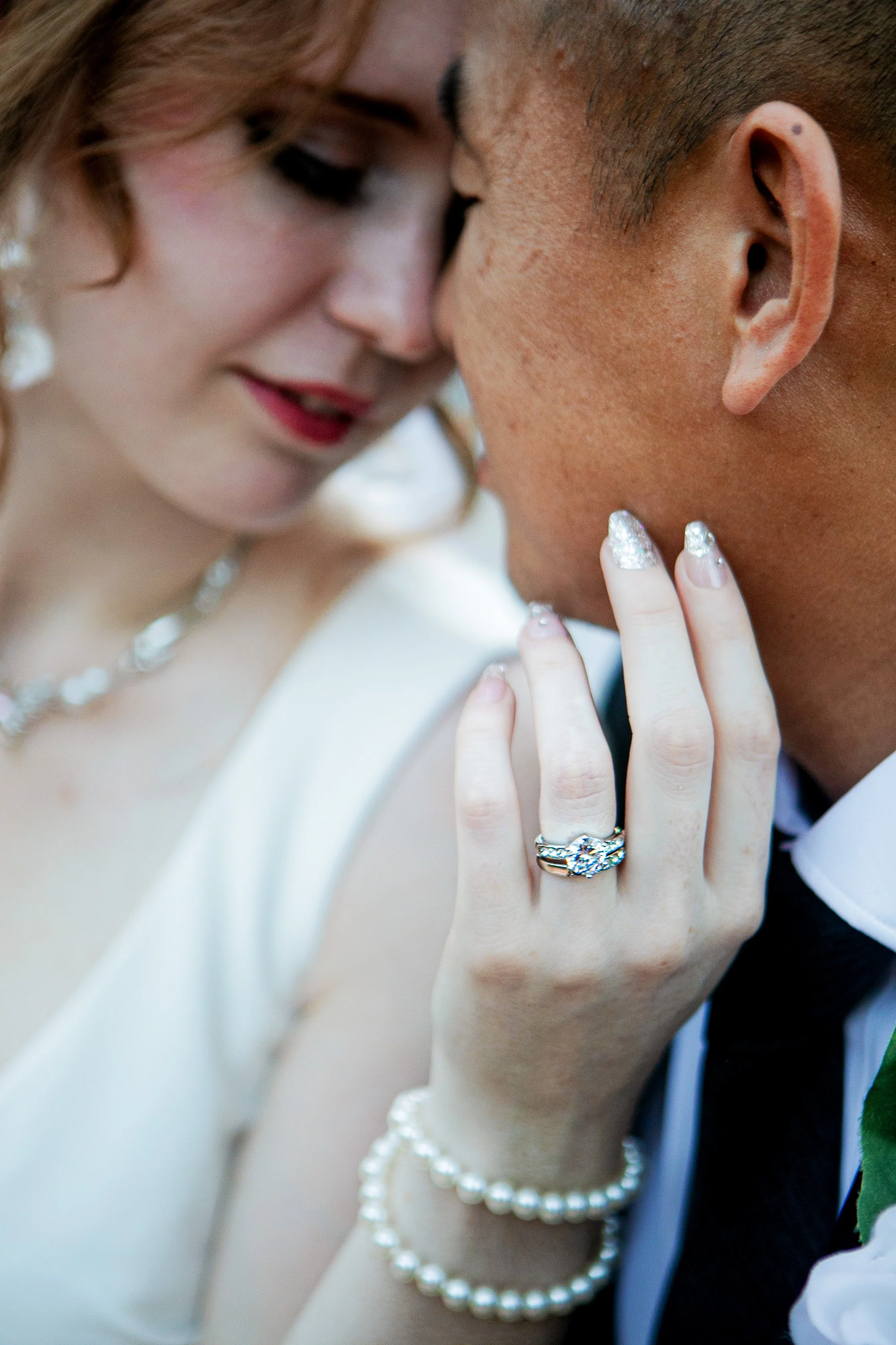 Rana and Nick during their intimate elopement in Mesa, Arizona, photographed by TallulahMade Photography. This romantic wedding portrait captures the couple celebrating their marriage against the warm desert architecture of Mesa, blending candid conn