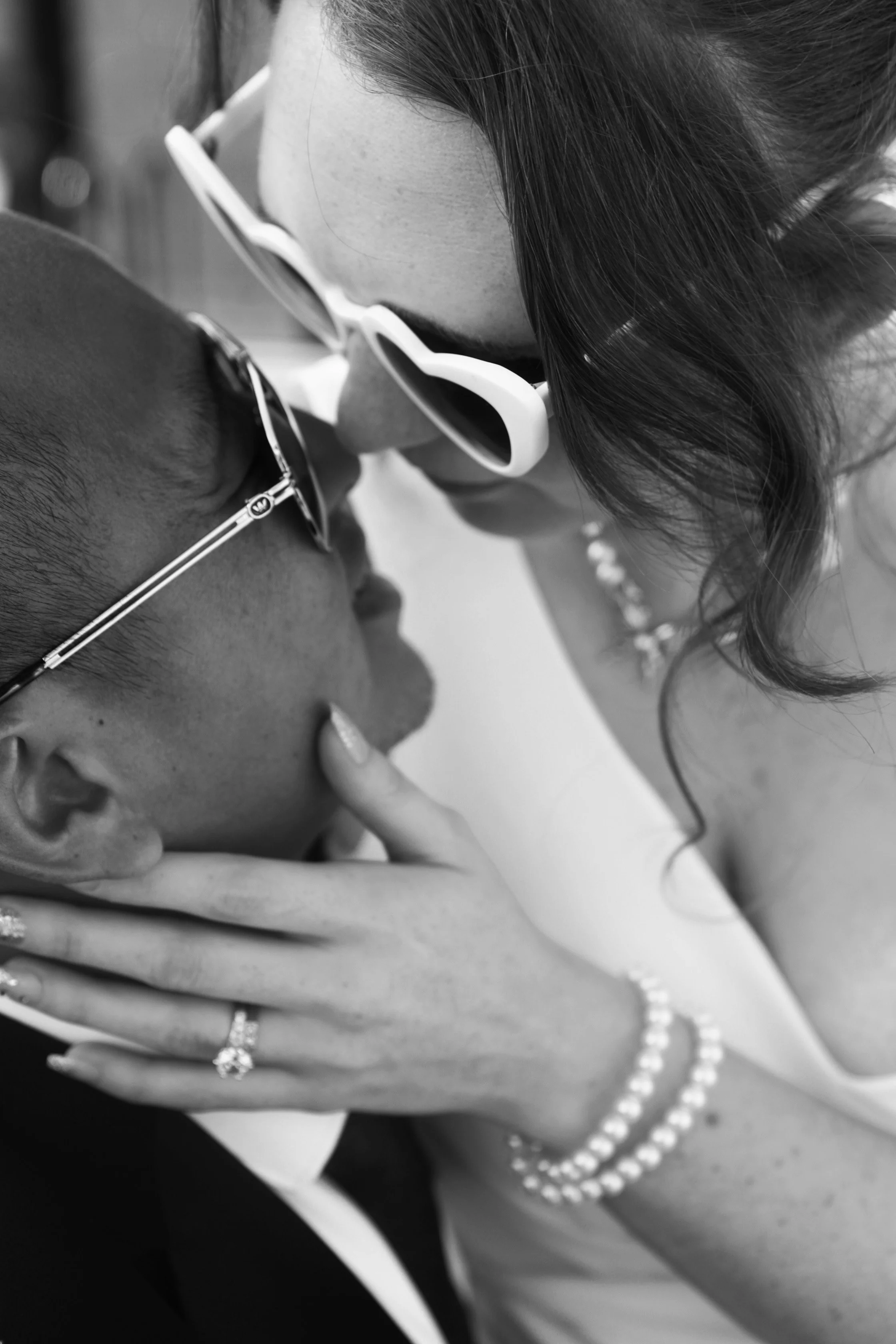 Rana and Nick during their intimate elopement in Mesa, Arizona, photographed by TallulahMade Photography. This romantic wedding portrait captures the couple celebrating their marriage against the warm desert architecture of Mesa, blending candid conn