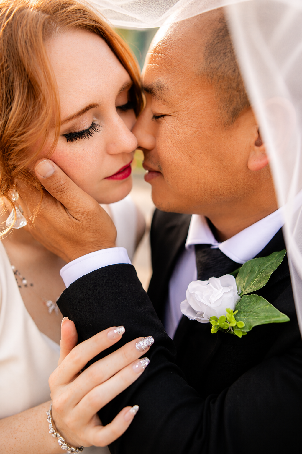 Rana and Nick during their intimate elopement in Mesa, Arizona, photographed by TallulahMade Photography. This romantic wedding portrait captures the couple celebrating their marriage against the warm desert architecture of Mesa, blending candid conn