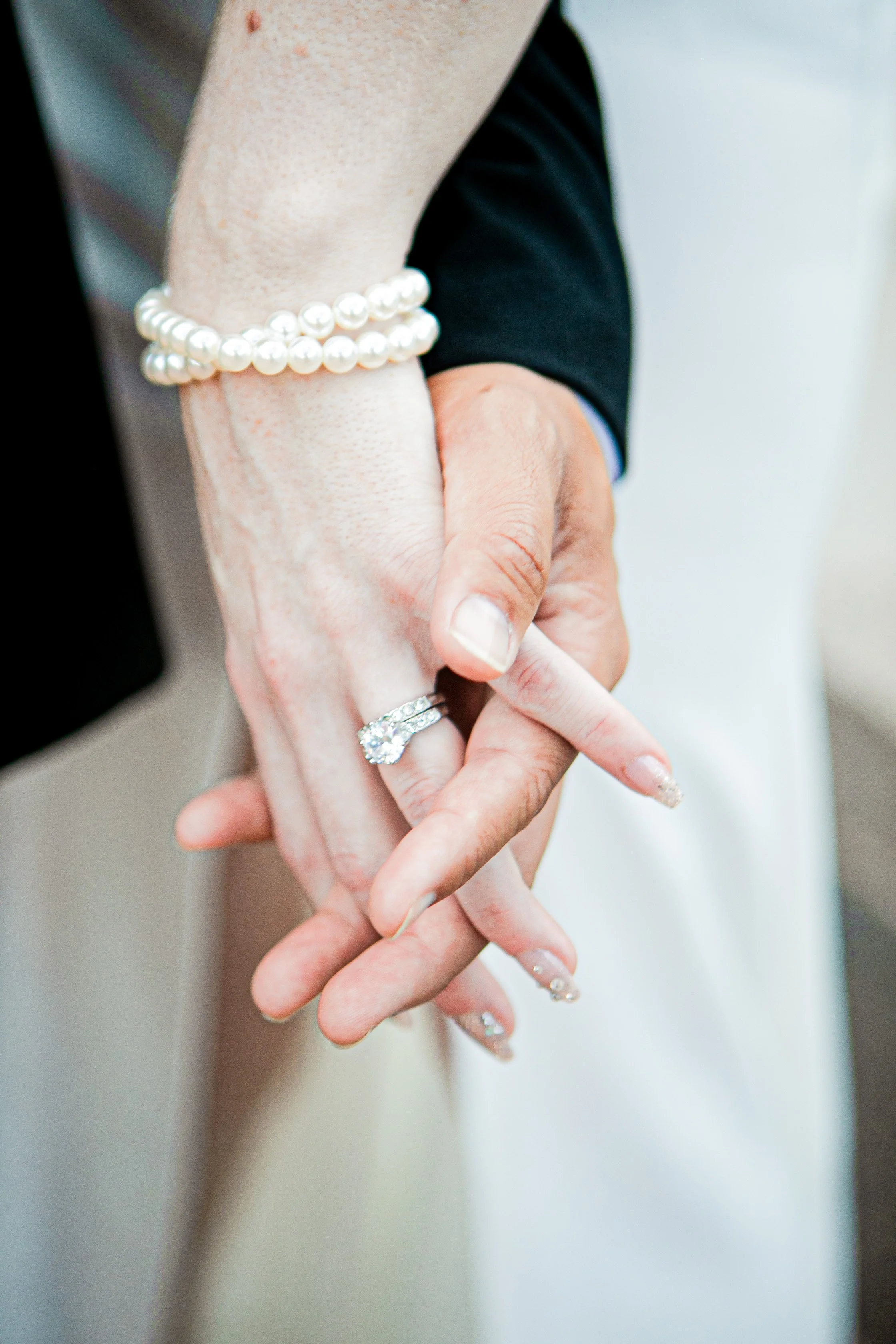 Rana and Nick during their intimate elopement in Mesa, Arizona, photographed by TallulahMade Photography. This romantic wedding portrait captures the couple celebrating their marriage against the warm desert architecture of Mesa, blending candid conn