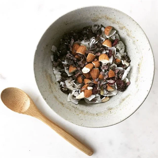 🥛Cereal doesn’t have to be an overly processed sugary meal. 🌰You can use seeds, nuts, and dried fruit to make your own healthier version at home. 🥣I grew up on cereal and love the texture and bite, but I don’t love that store brands have a lot of additives and sugar. 🍒So this is my crunchy, tangy, and satisfying version. 🥥Made with coconut flakes, almonds, sunflower seeds, pumpkin seeds, cocao nibs, dried cranberries, and finished off with almond milk!