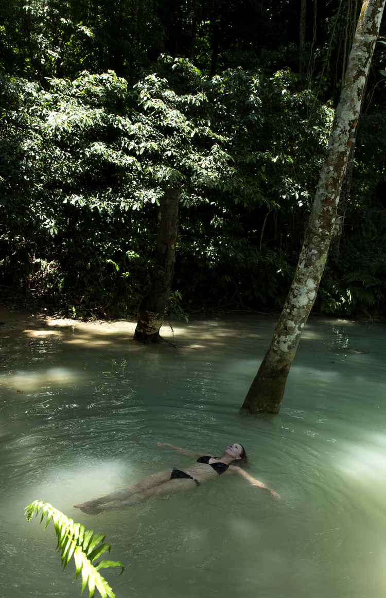 Michelle Larson - A photo I took of Julie at Kuang Si Falls in Luang Prabang, Laos. The epitome of exotic and mysterious, with its jade green milky water that flows down flat rock terraces creating tranquil pools that beg to play, float and dream in.