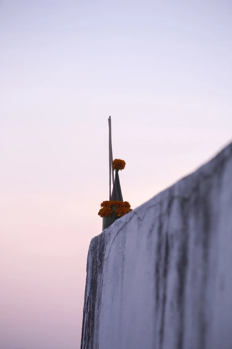 Julie Cimpko - A serene moment – a buddhist offering at dusk on the very top of Mount Phousi in Luang Prabang, Laos.