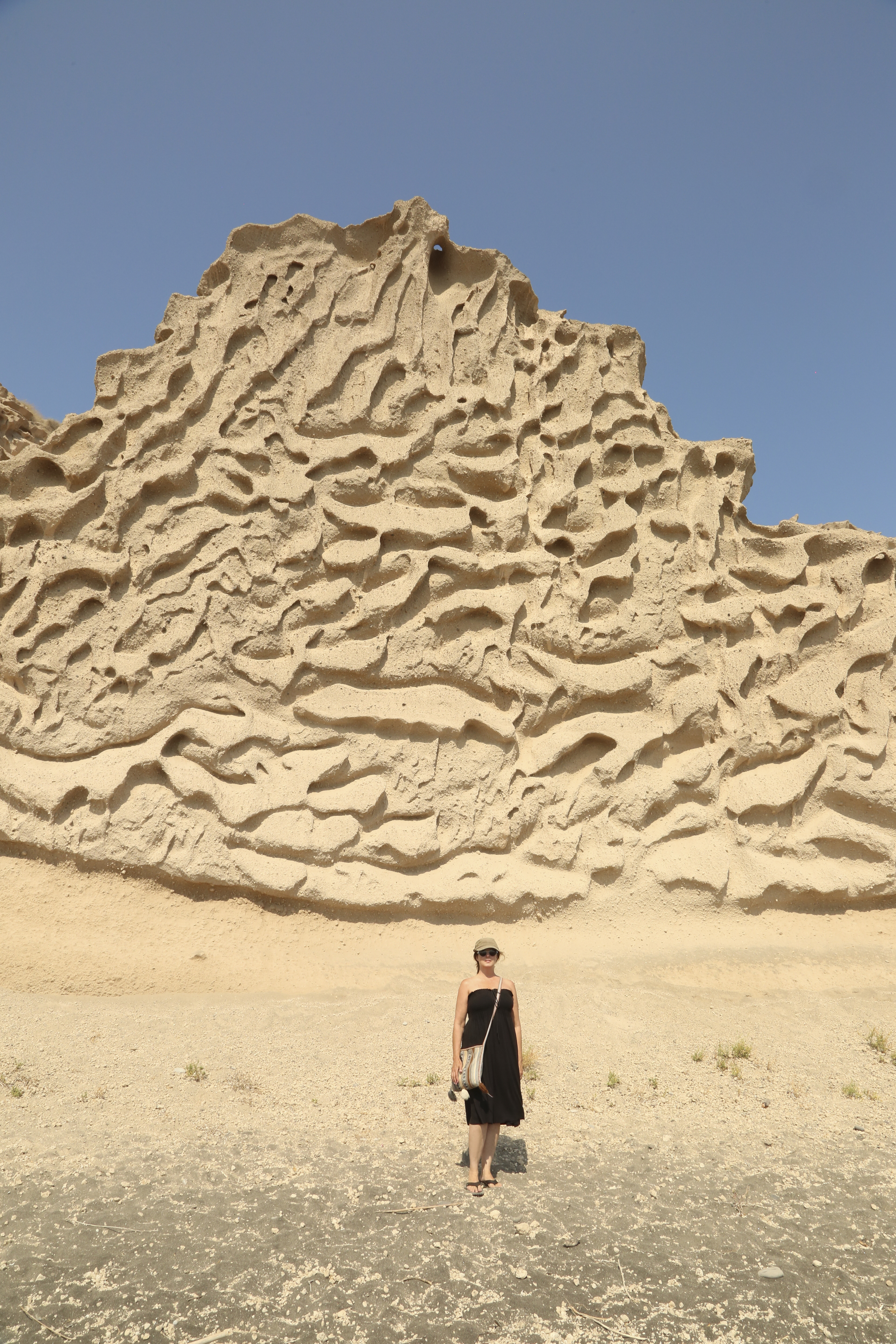 Michelle Larson – On the island of Santorini, the wind has carved the sand hillsides into textured walls. Nature’s art fascinates me. 