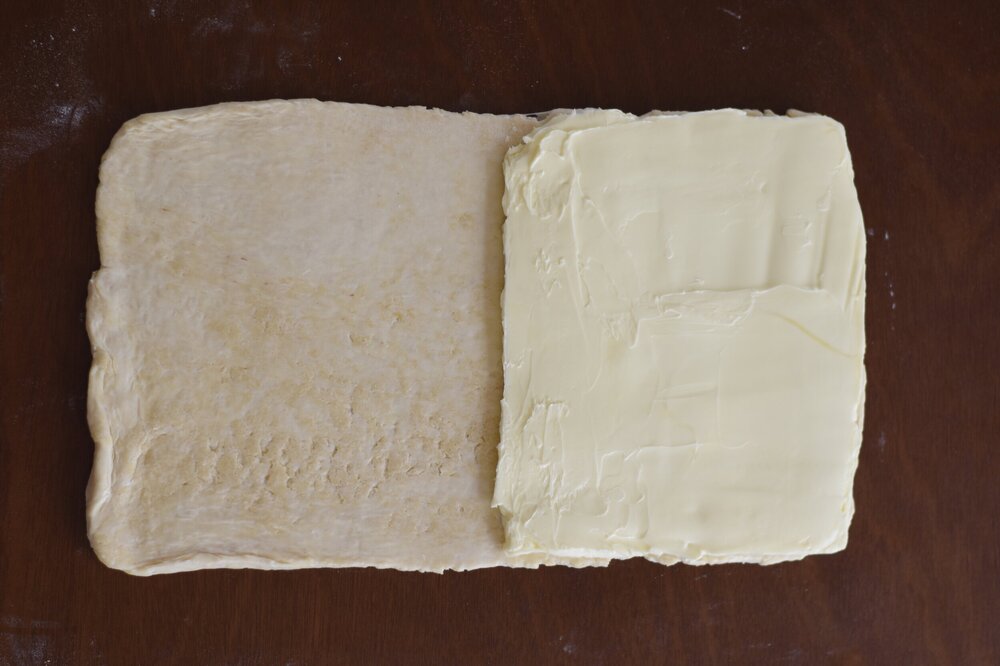  preparing to close the butter block into the dough packet  