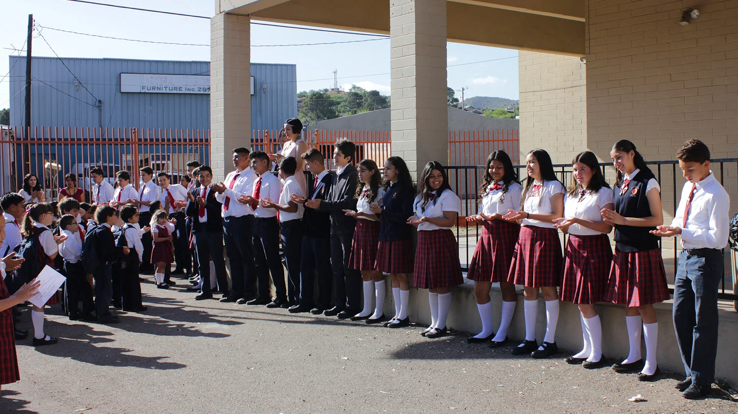 The deprting 8th graders lead the school in reciting the SLE's on final time.