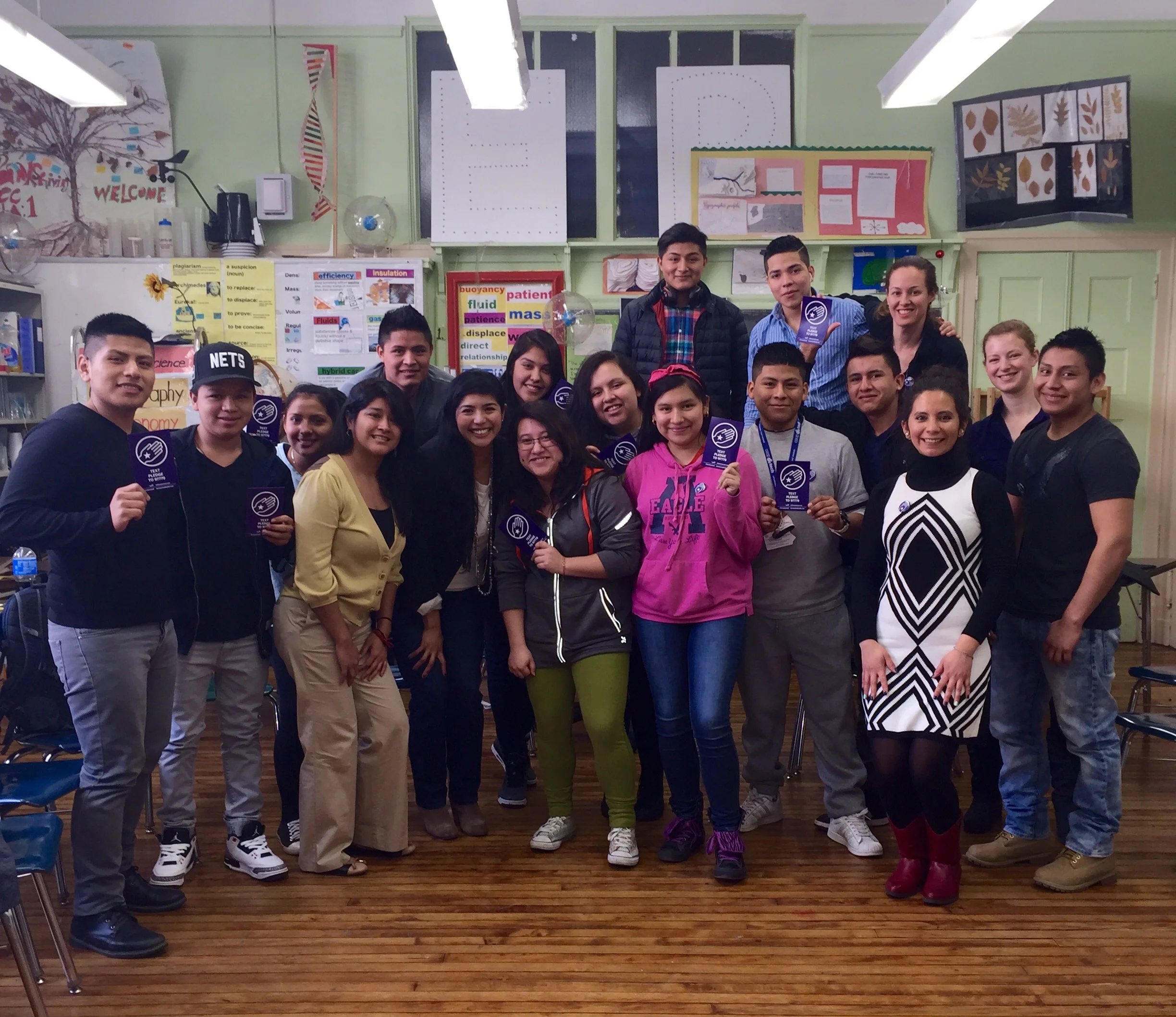 ALIANZA students holding the 'The Pledge' for immigration fairness.