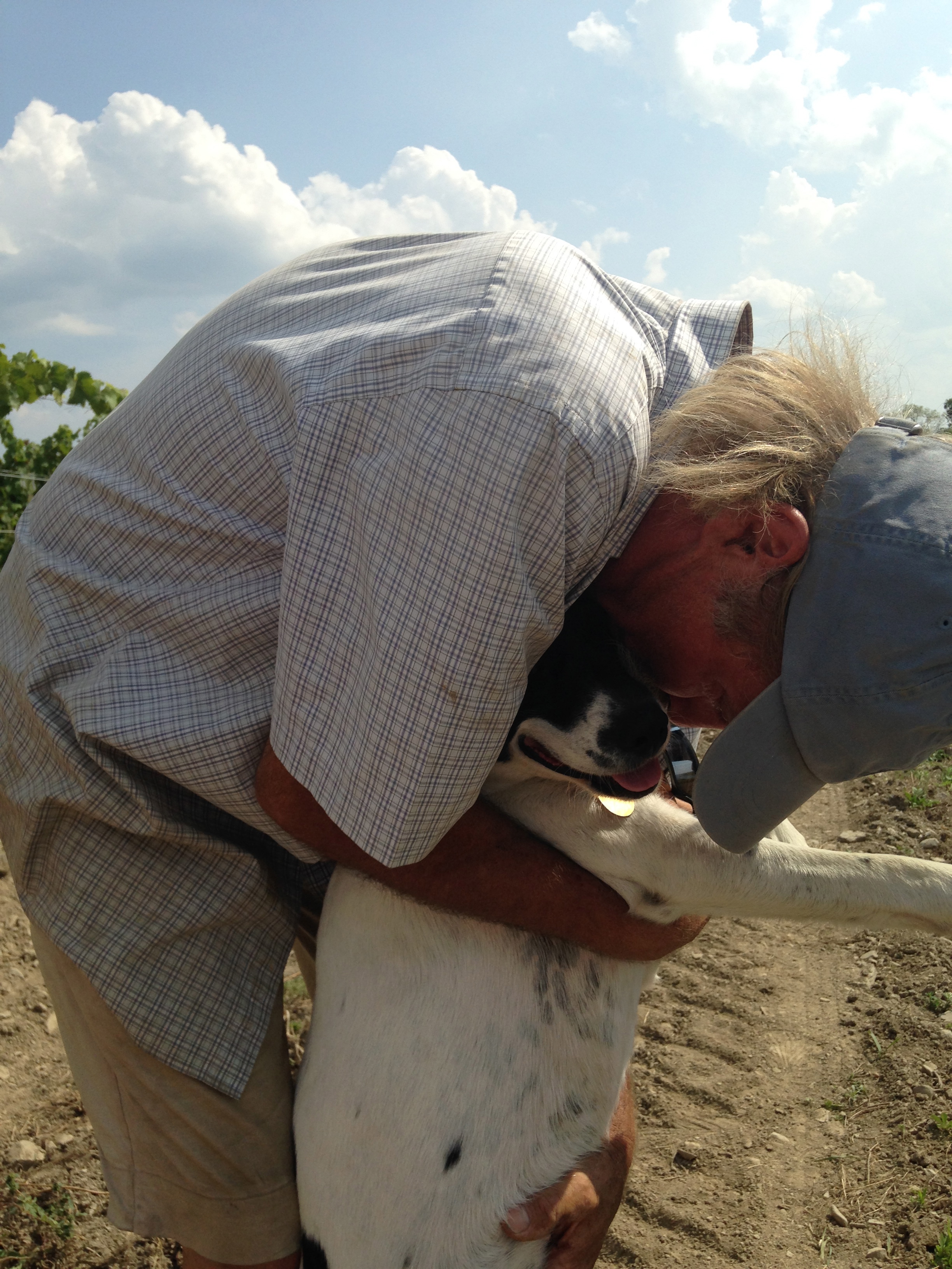 Bloomer Creek's Kim Engle with lucky vineyard dog, Odie