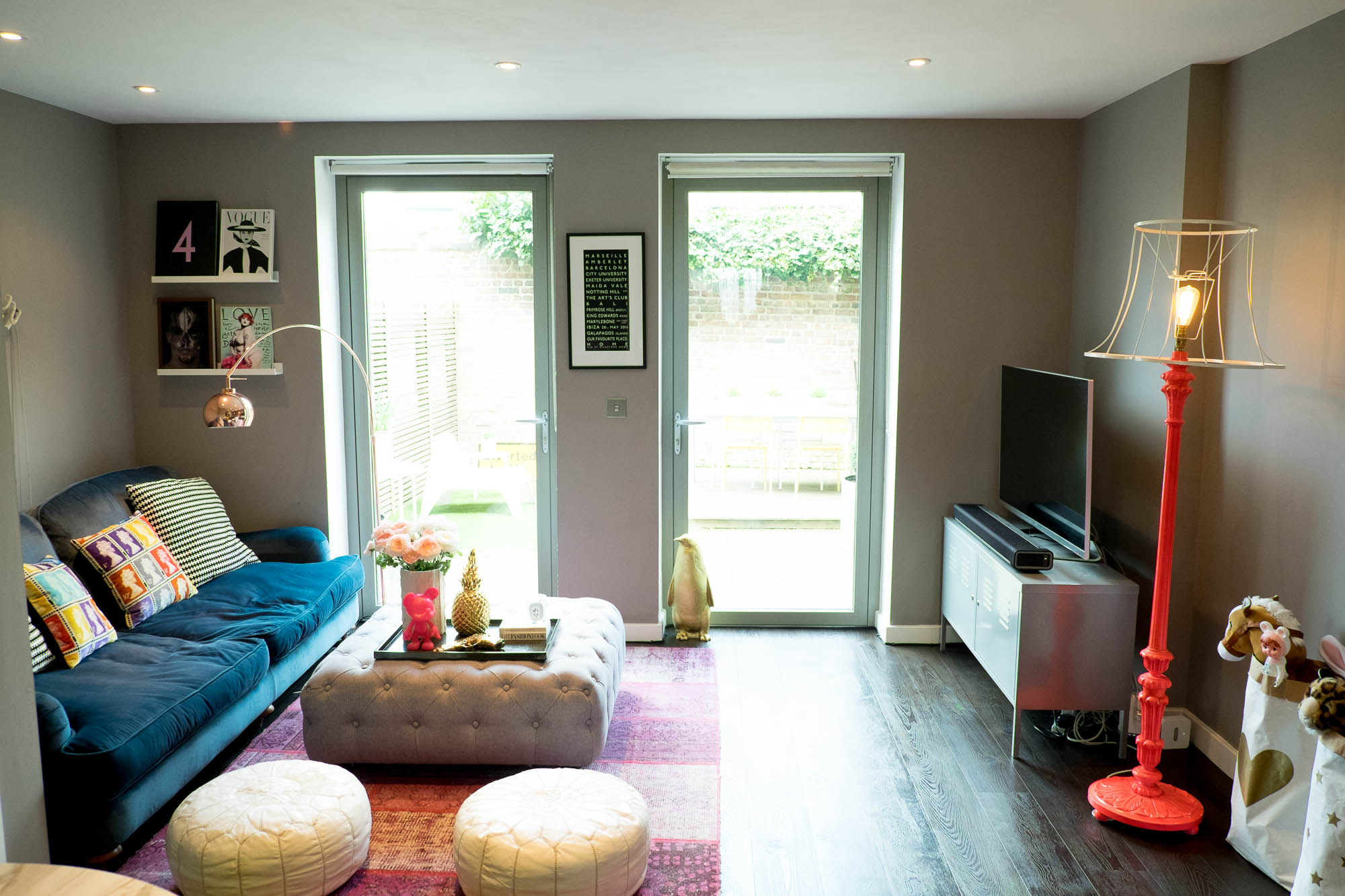 Despite repainting the walls in a dark colour, the room actually looks more spacious...