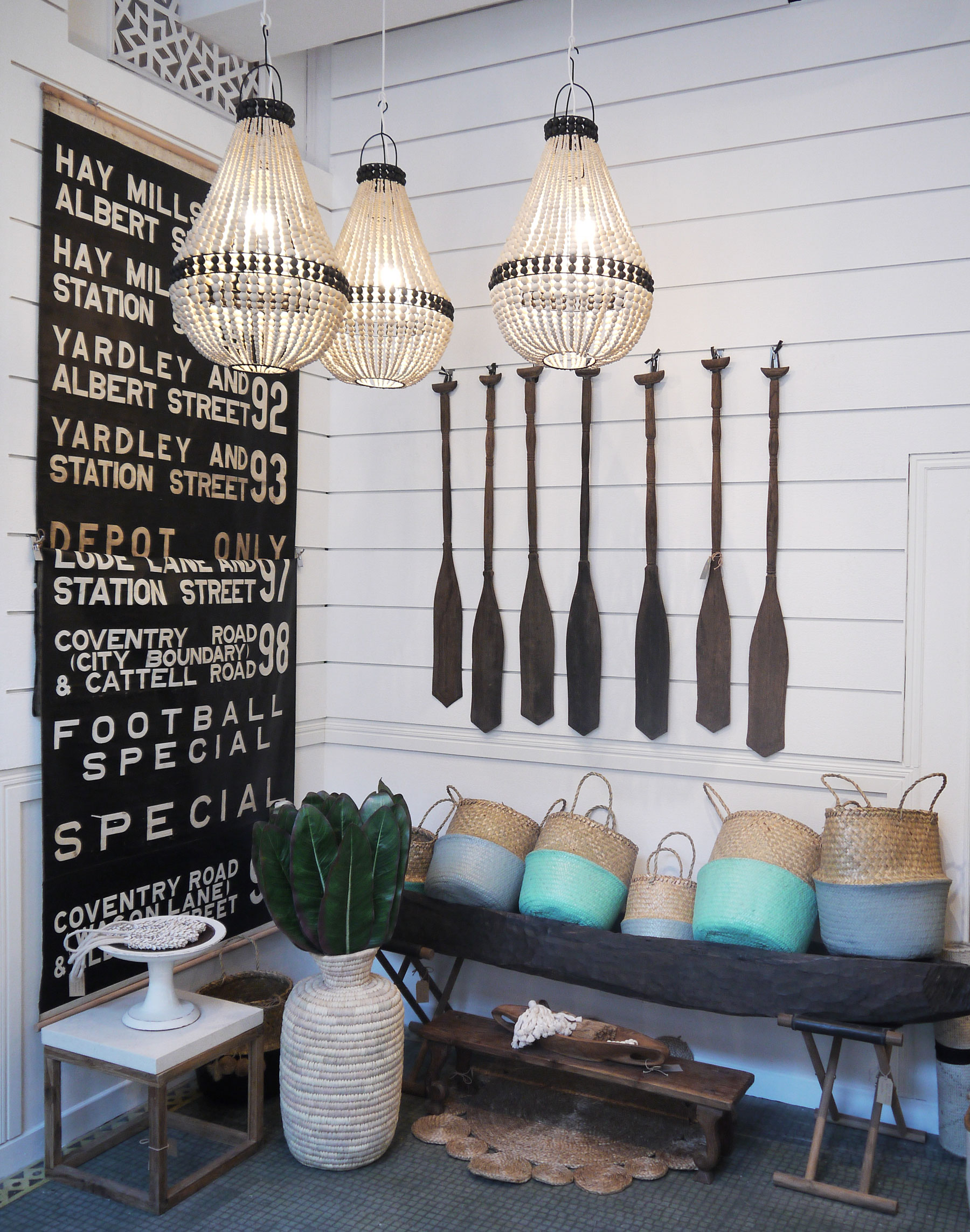 A vintage bus roll, turquoise painted wicker baskets, and beaded chandeliers? Yes please...