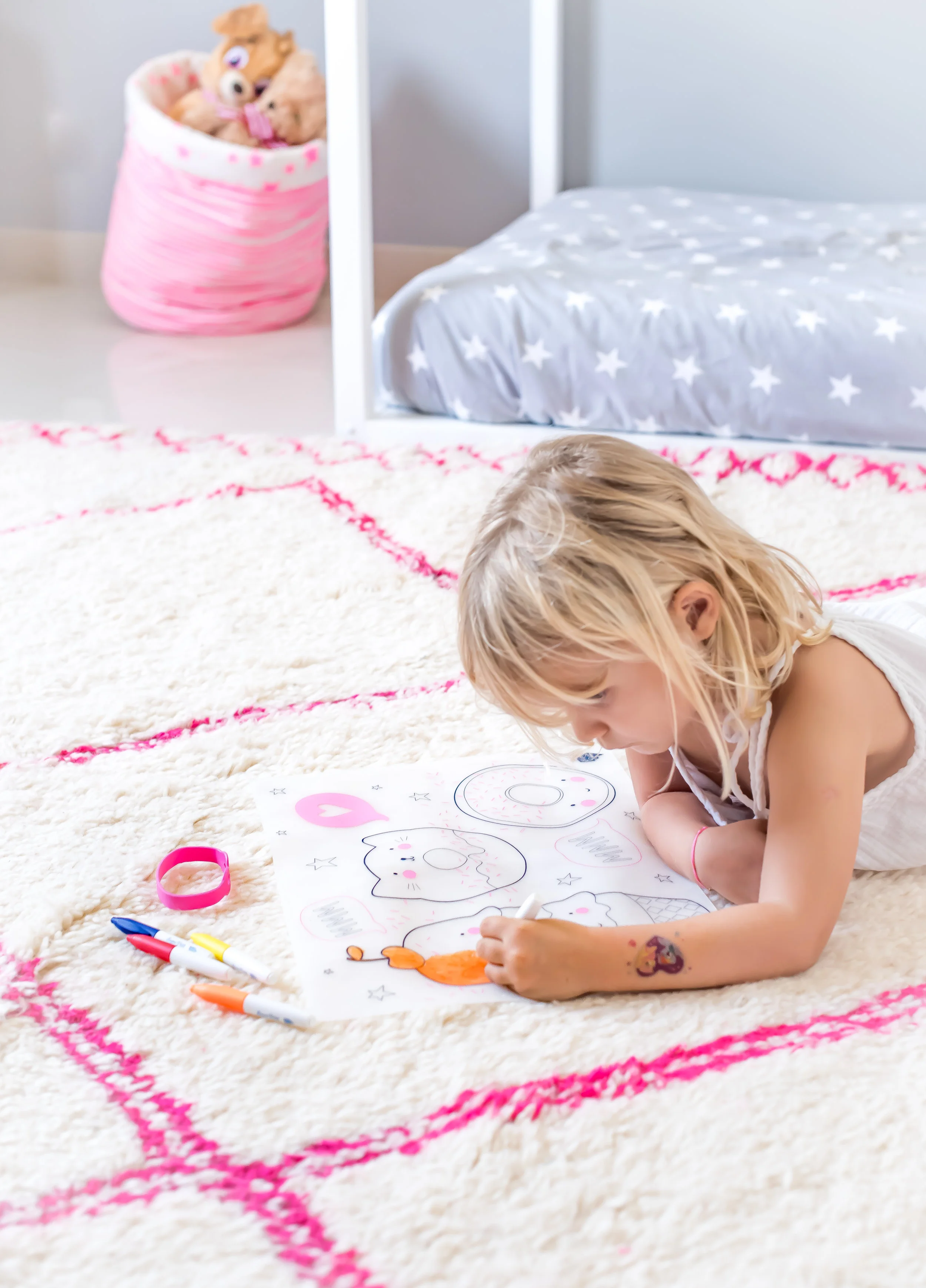 Stella in deep concentration with her colouring placemat... photo credit: Karen Pissarra @designk