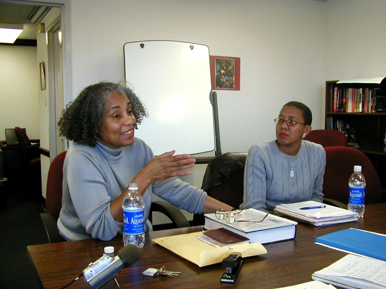 Former leader of the Southern African Support Project and professor Dr. Sylvia Hill discusses the South African liberation struggle as Milagros Denis listens attentively at the office of the South African Research and Archival Project, Howard Univer…