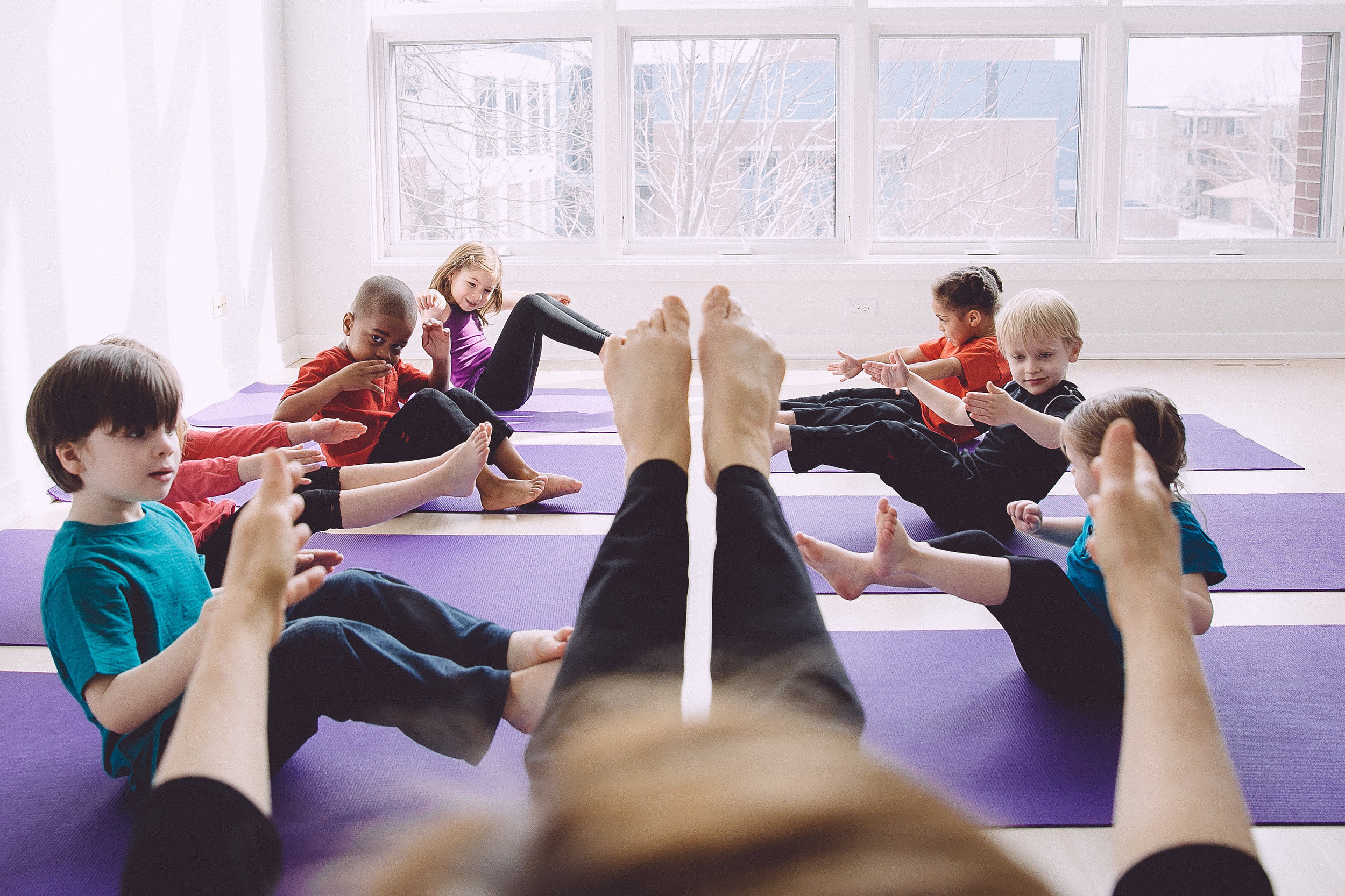 Row, row, row your boat pose with the pre-school YogaKids