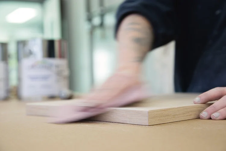 Sanding each of the surfaces is an important step in the preparation of the materials.