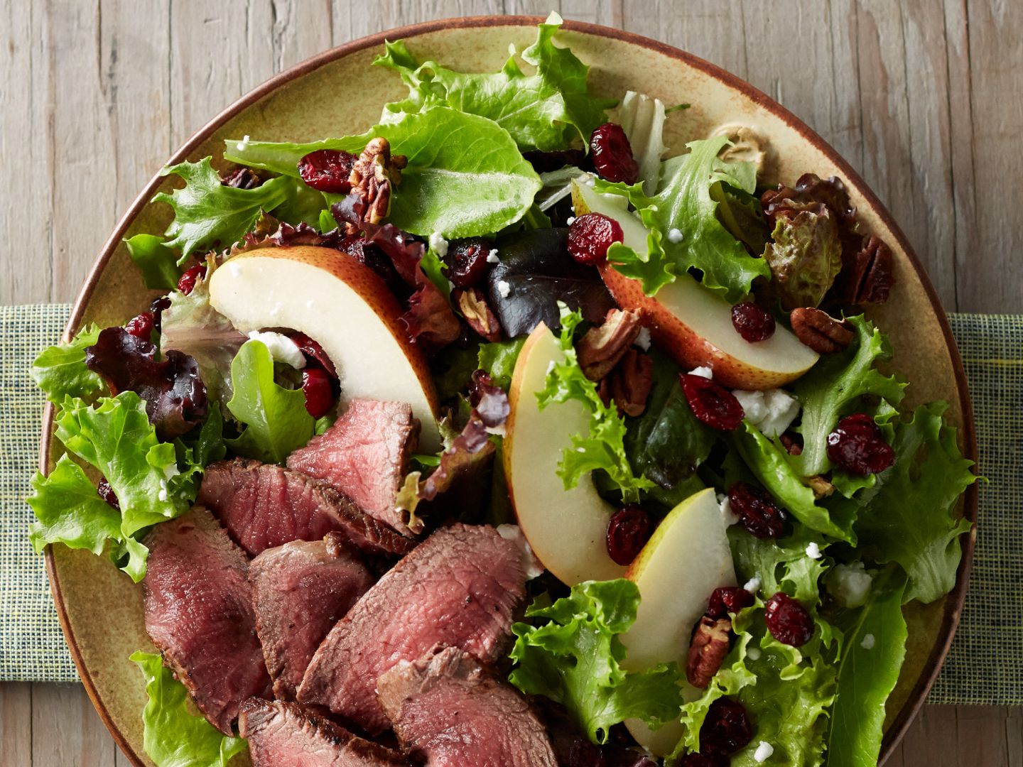 tenderloin-cranberry-and-pear-salad-with-honey-mustard-dressing-vertical-aerial.jpeg
