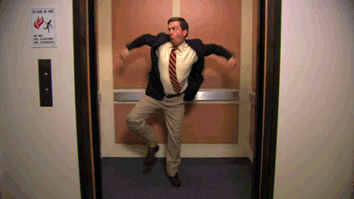 Happy man dancing in elevator - what freelance designers do when they get paid