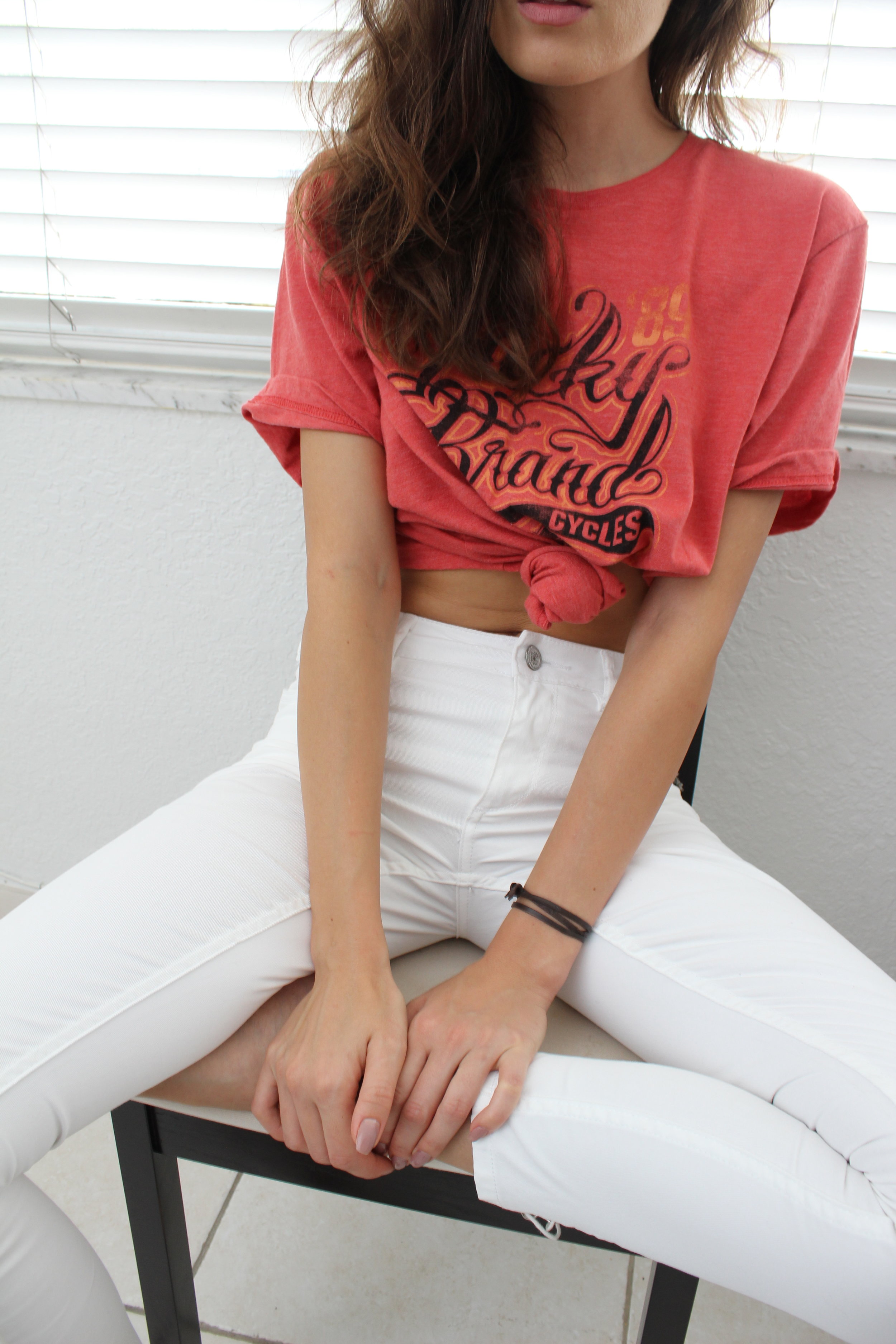 Red T-shirt white trousers fashion close-up photo