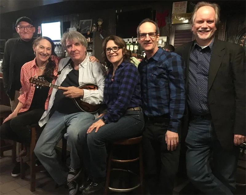 John Baumgartner – vocals, keyboard, accordion, percussion Toni Baumgartner – vocals, flute, recorder, clarinet, percussion Matthew Davis – vocals, guitar, bass, percussion Jon Fried – vocals, banjo, guitar, bass Ed Seifert – vocals, guitar, mandolin, harmonica Deena Shoshkes – vocals, guitar, bass, percussion This group is a songwriter’s dream sextet, bringing together some of New Jersey’s most acclaimed indie rock writers and performers: John and Toni Baumgartner and Ed Seifert (Speed The Plough), Deena Shoshkes and Jon Fried (The Cucumbers) and Matthew Davis (The Thousand Pities).