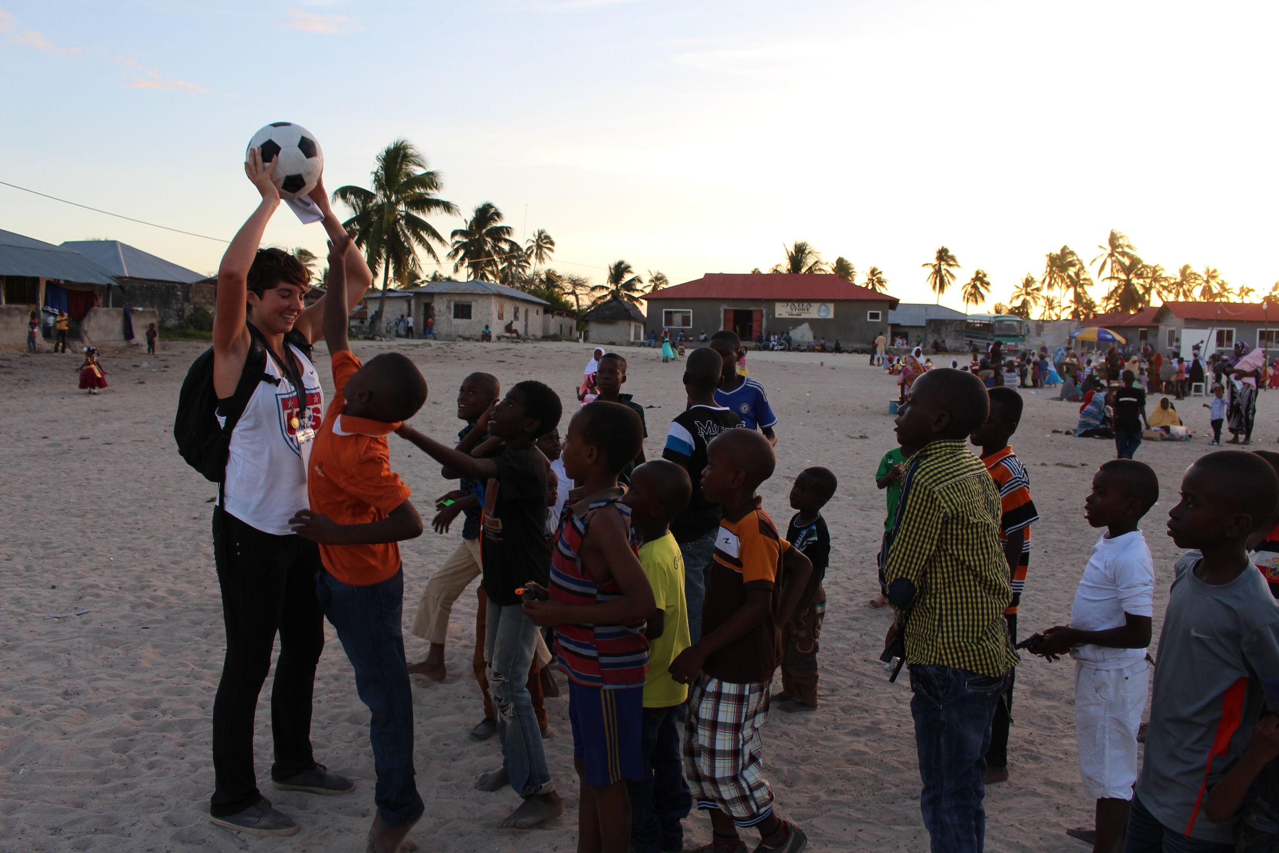 Megan playing soccer with Paje boys