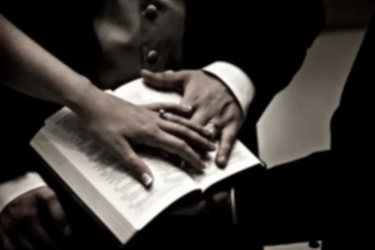 Wedding-rings-hands-on-bible.jpg
