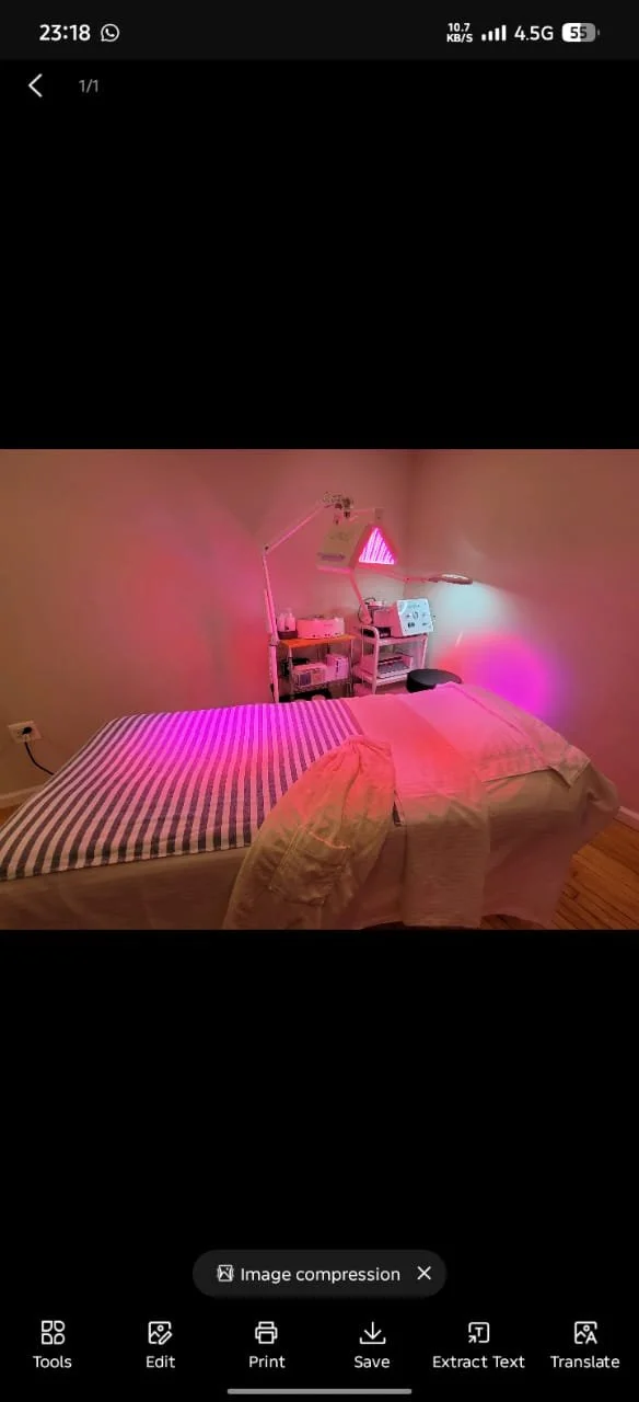 Esthetician performing a sculptural facial massage at Harmony Day Spa