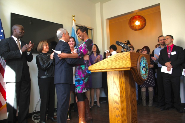 Embracing Rahm Emmanuel after giving a speech, sharing my story at the Wings Metro Event, February 2016