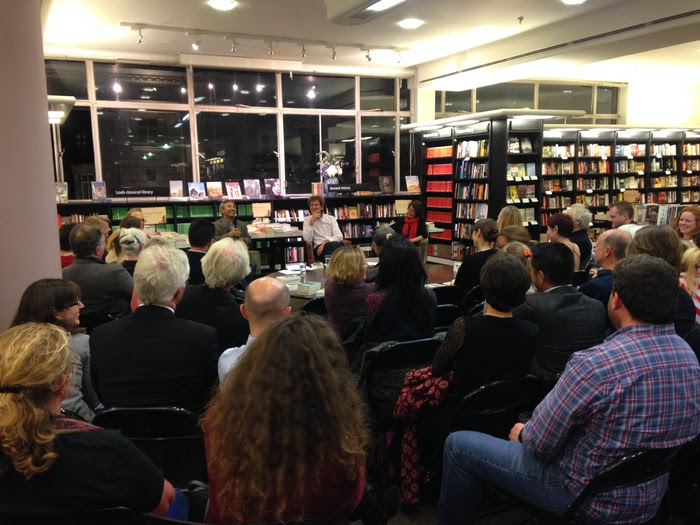 Ismailov, Barnes, and Ermakova speak to a packed house