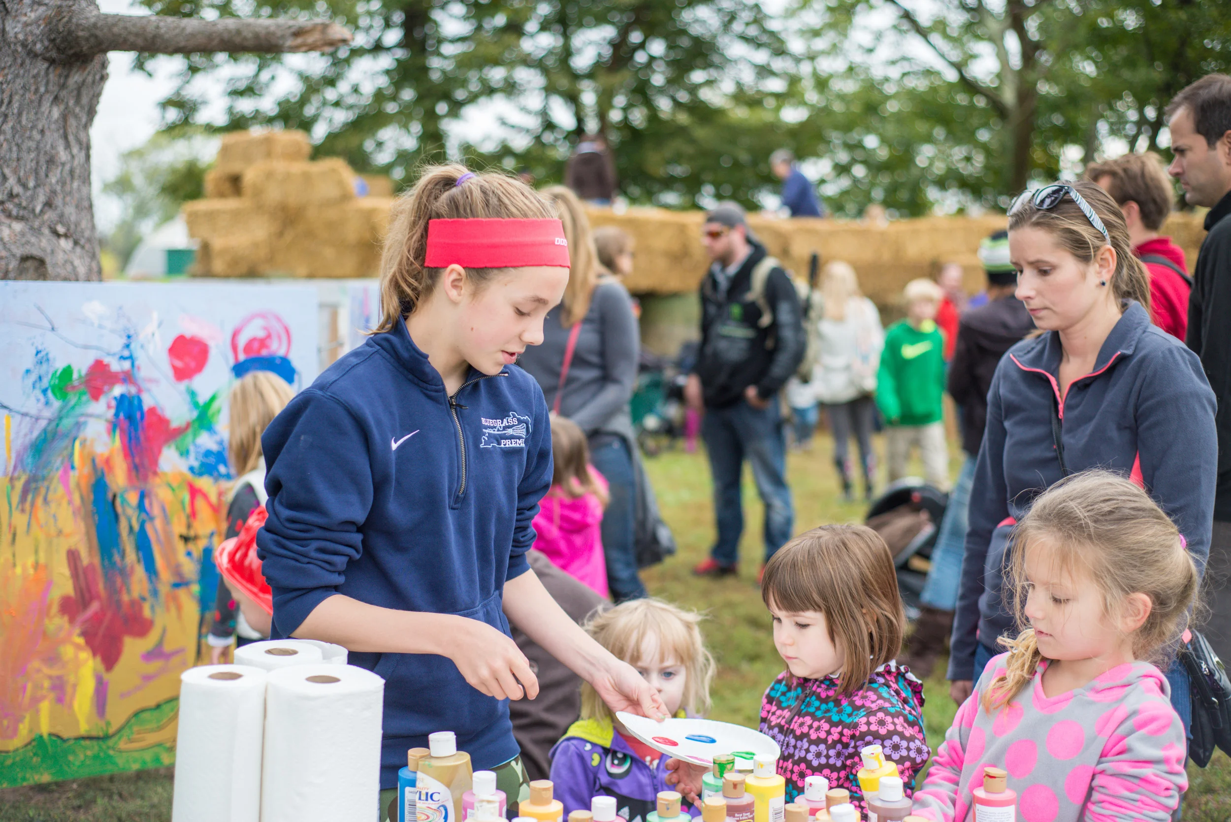 A CFAC student volunteers at the Foxhollow Farm Festival