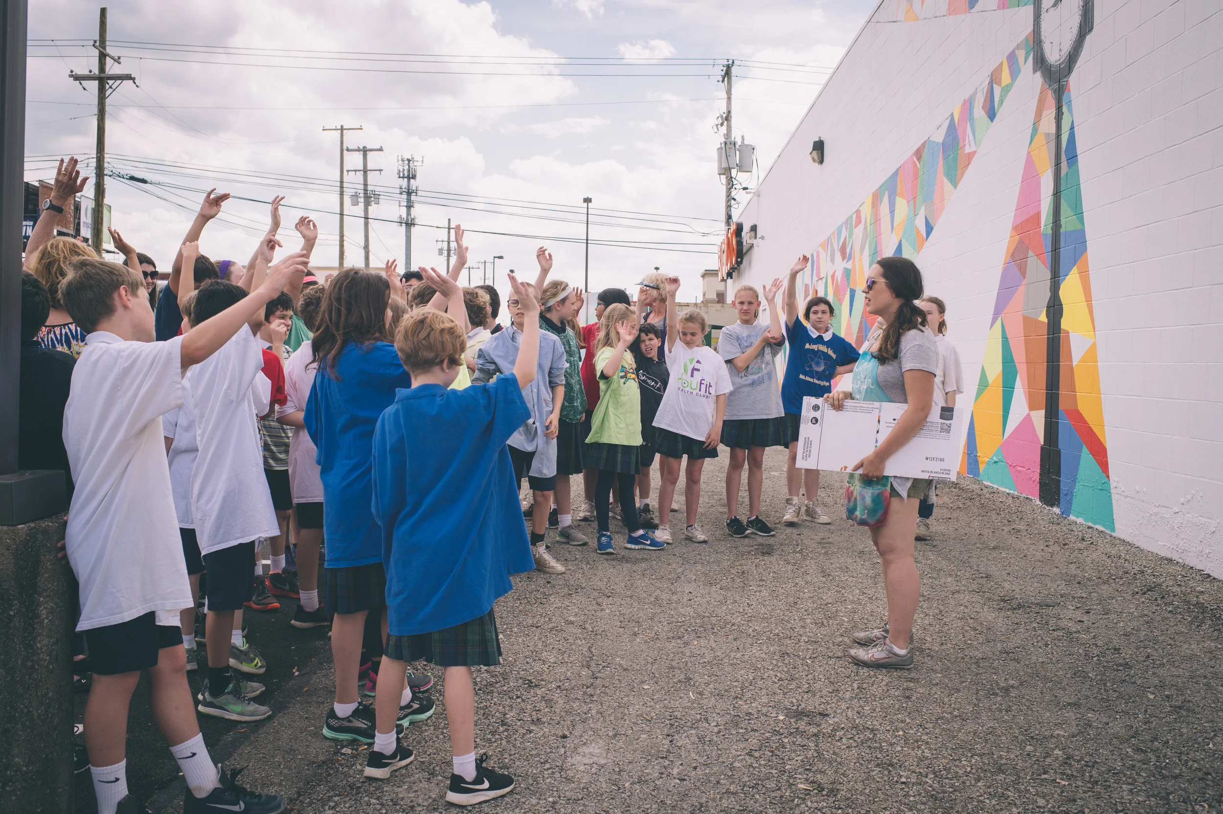 Liz Richter works with elementary school students at the Hikes Point Mural through Center for Neighborhoods' PAINT program.