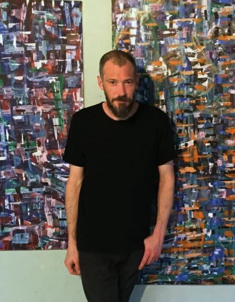 A photograph of artist Jeremy Brightbill in studio.