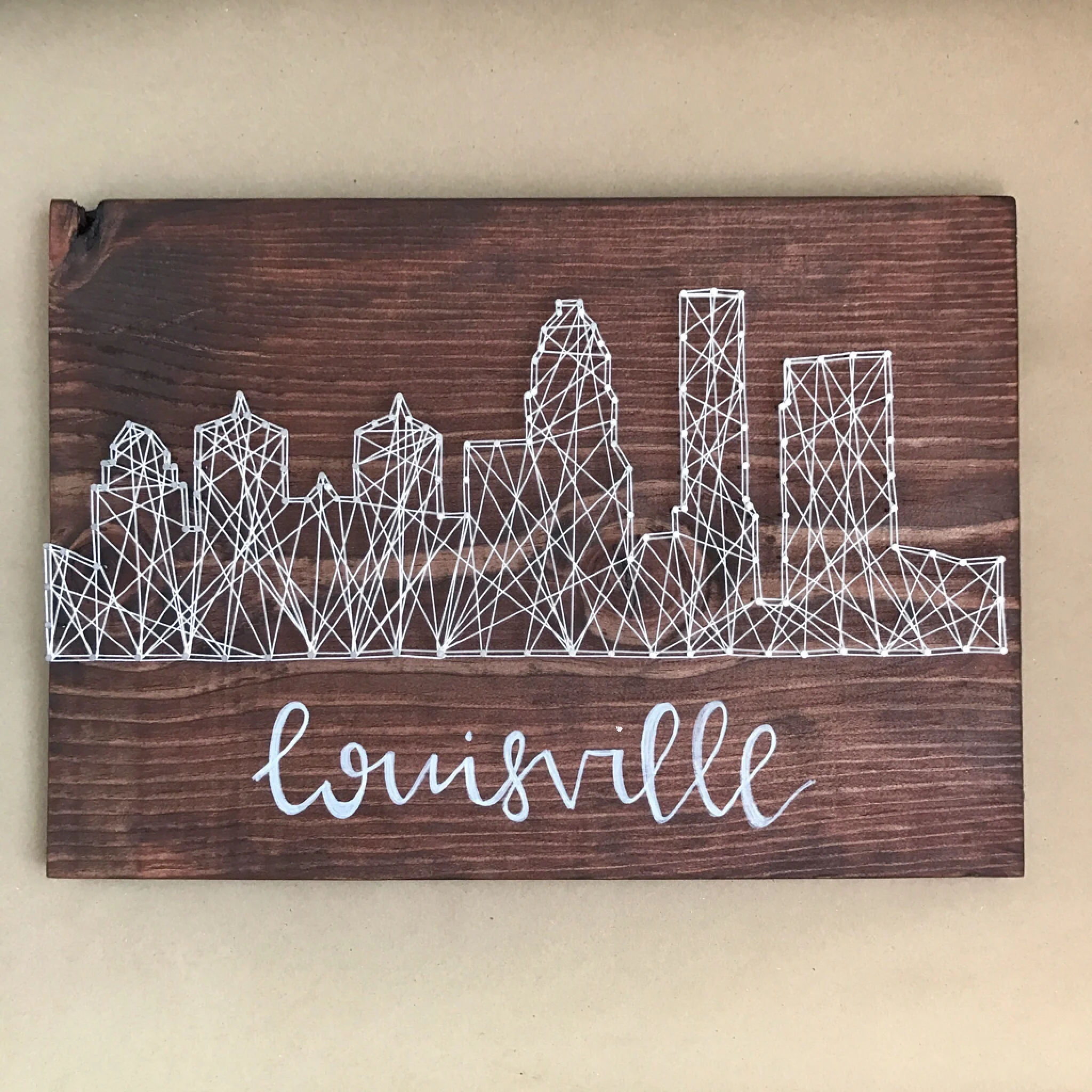 “Louisville Skyline” by Wood & Twine, 16x12in, wood, string (2016), $75 | BUY NOW