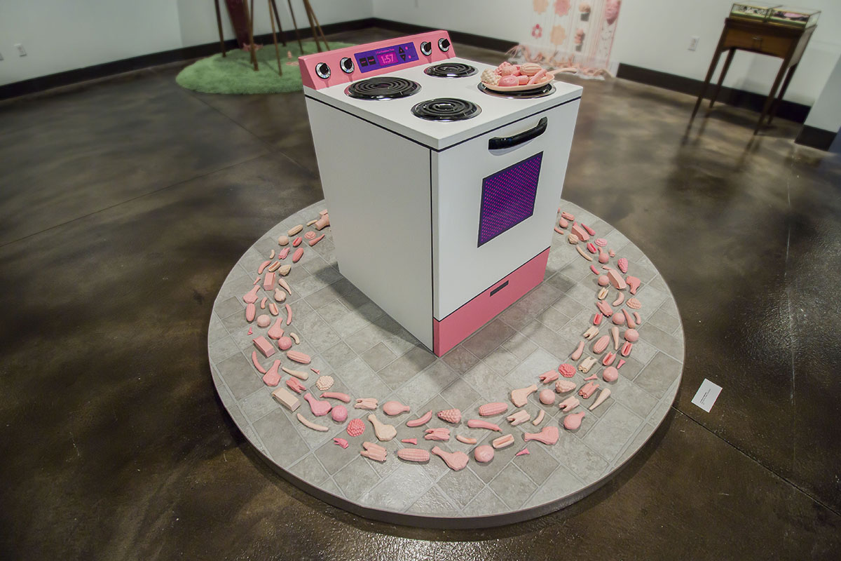 "I can feel your sweet decay." by Miranda Becht, 38x73x73in, wood, sticker paper, acrylic paint, cast resiin, linoleum, found objects (2017)