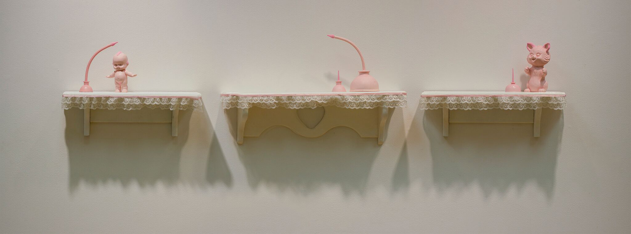 "The sweet nostalgic sadness of something lovely and lost. (Order)" by Miranda Becht, 13x68x5in, tinted cast resin, flocking, lace, shelves (2016)