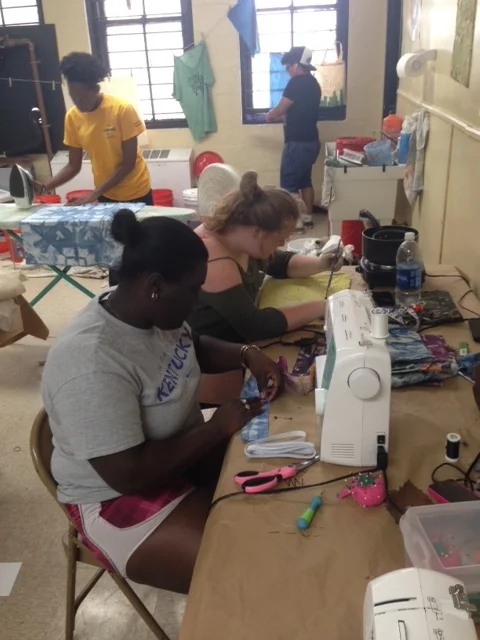 Donielle Panky & Carol Watson at the sewing table.